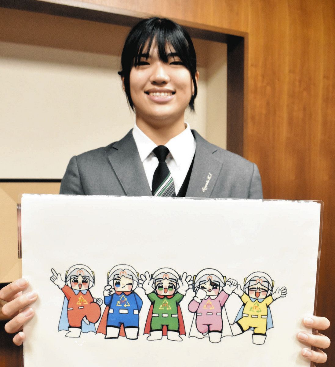マッタマンのイラストを描いた田島さん＝豊明市役所で
