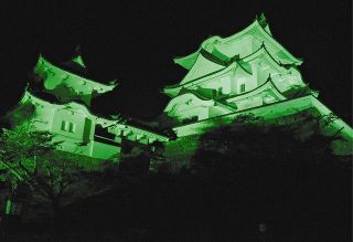 伊賀上野城、安全カラーの緑色に　労災防止啓発へライトアップ